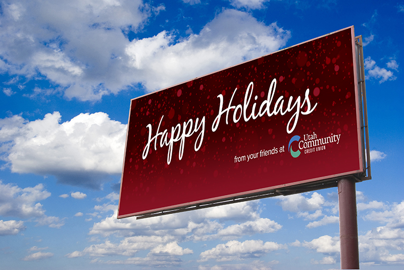 red snowy billboard reading Happy Holidays from your friends at UCCU